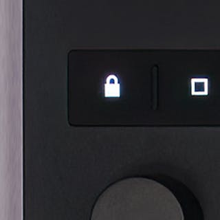 Detail photo of Push’s lock button.