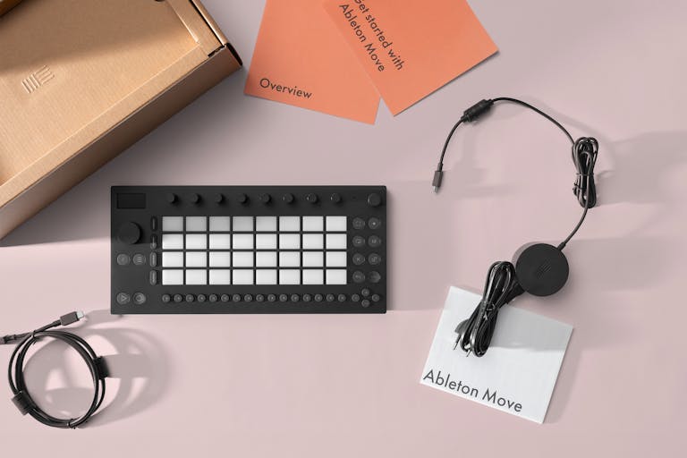 Angled view of Ableton Move lying on a pile of magazines